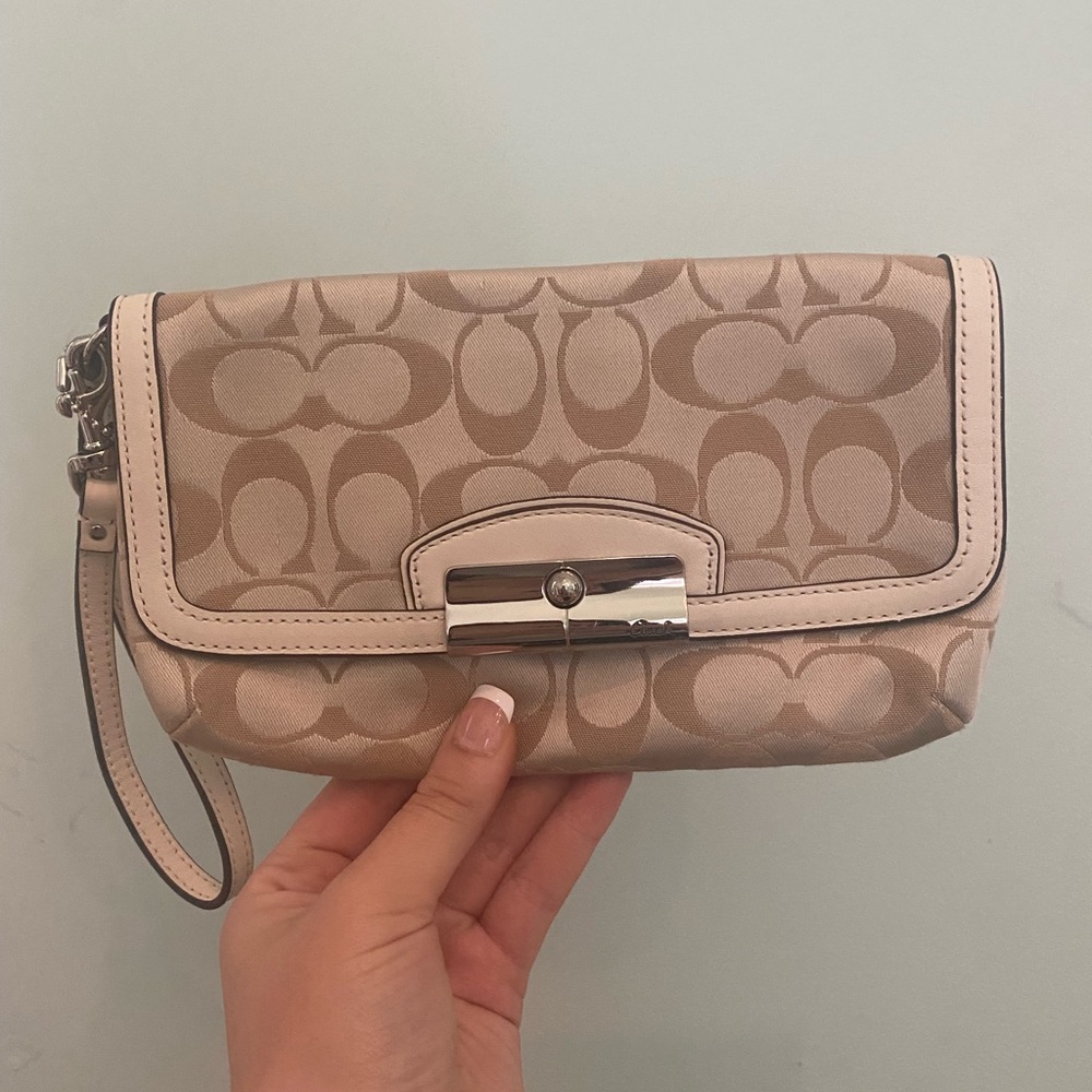 Tan and cream coach wristlet